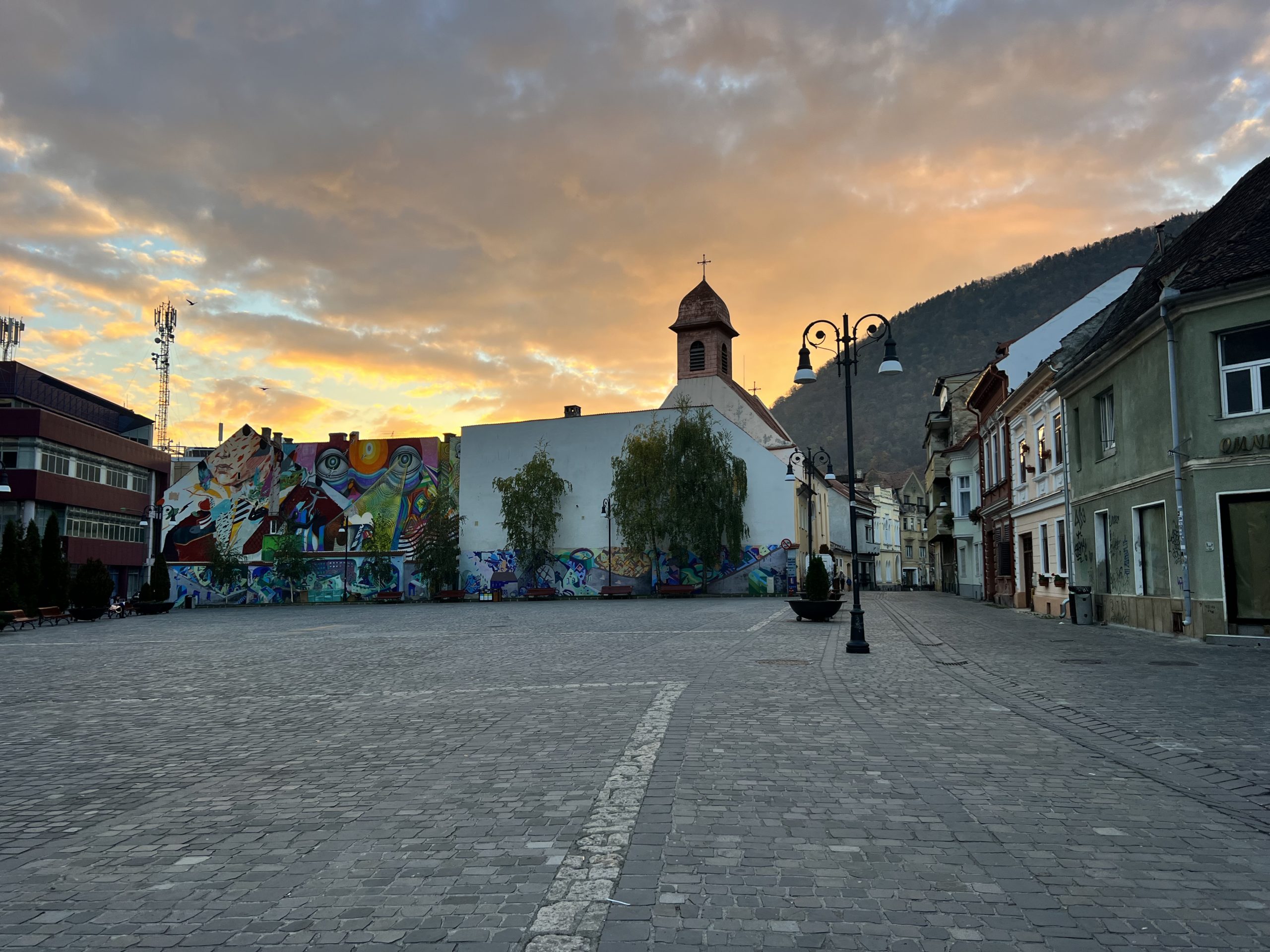 Brașov, Romania - A picturesque cityscape showcasing the enchanting charm of Brașov's historic architecture, colorful buildings, and scenic beauty; Travel guide to Brasov