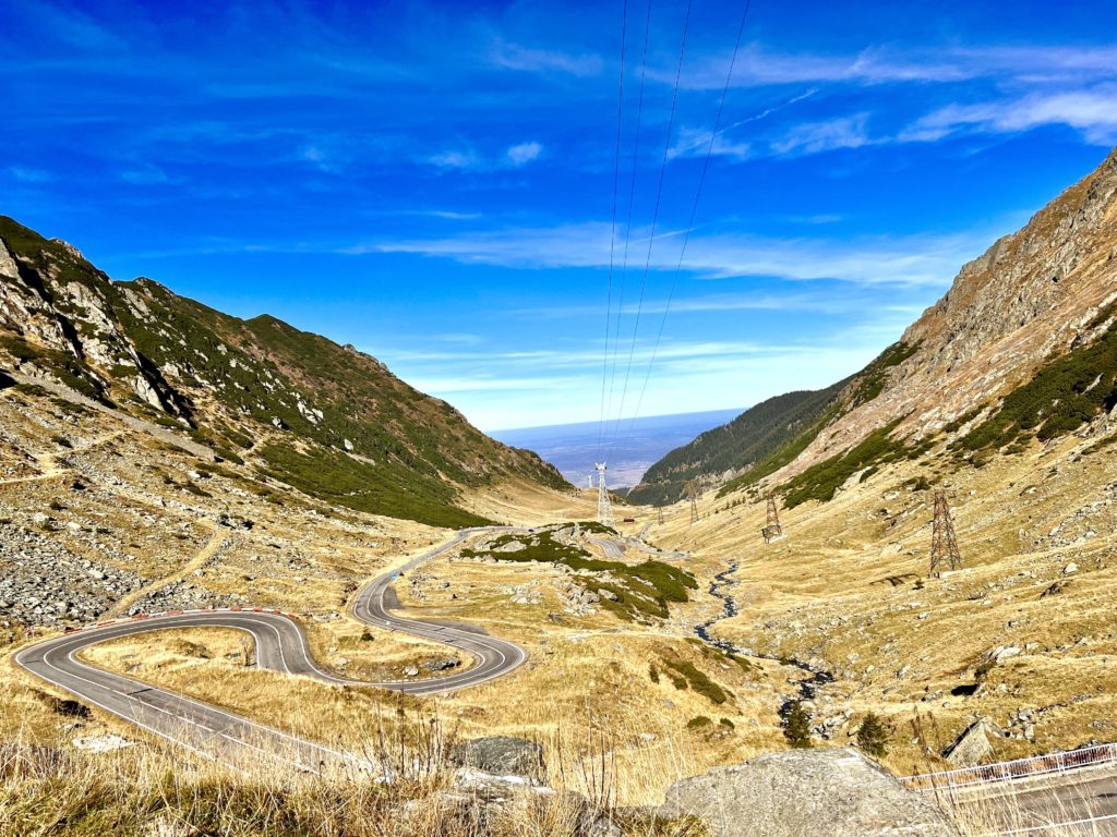 Transfăgărășan Highway - Majestic mountain road cutting through the Carpathian Mountains in Romania, offering breathtaking scenic views and thrilling driving experience; Travel Guide to Transfagarasan Highway.