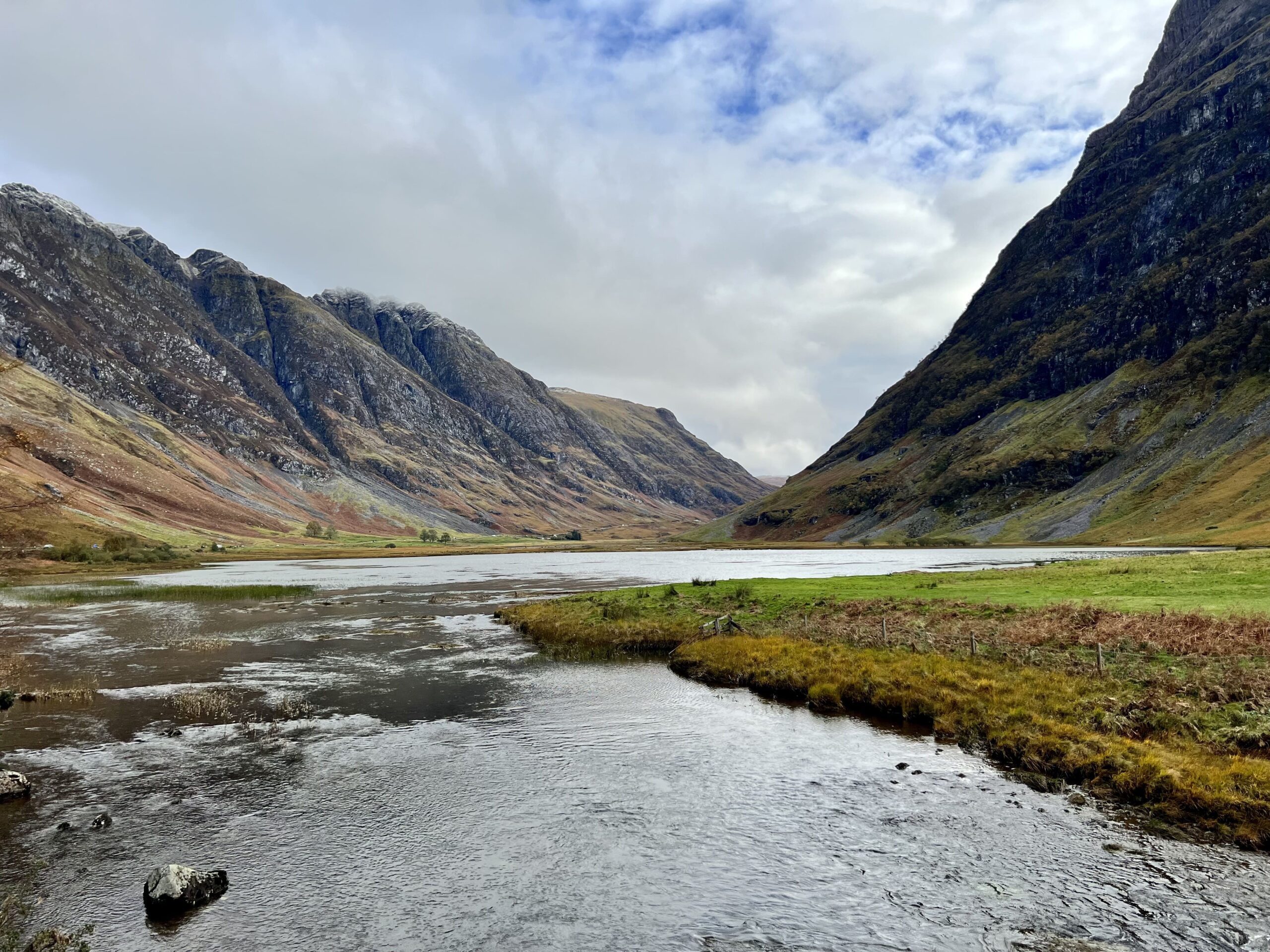 Captivating Scotland: Lush Green Hills under Overcast Skies - Travel Inspirations; travel guide to the Highlands