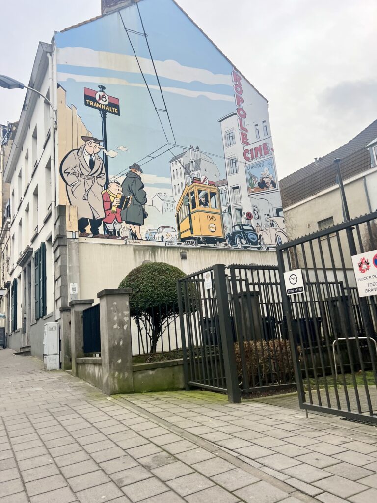 Enchanting view in Brussels, Belgium, with ornate medieval architecture and bustling activity, capturing the essence of Belgian heritage and culture; comic mural trails of Brussels