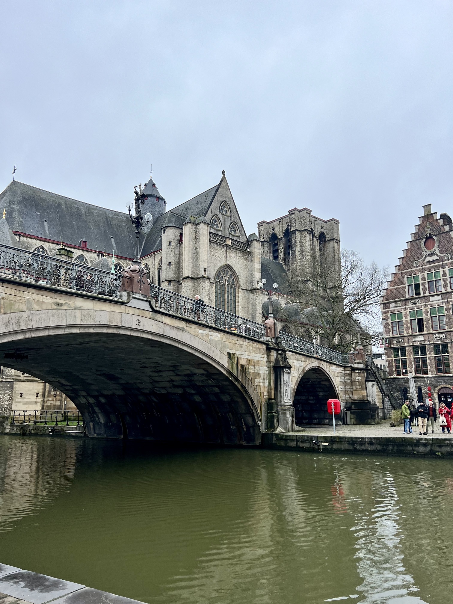 Enchanting view in Gent, Belgium, with ornate medieval architecture and bustling activity, capturing the essence of Belgian heritage and culture; travel guide to Belgium