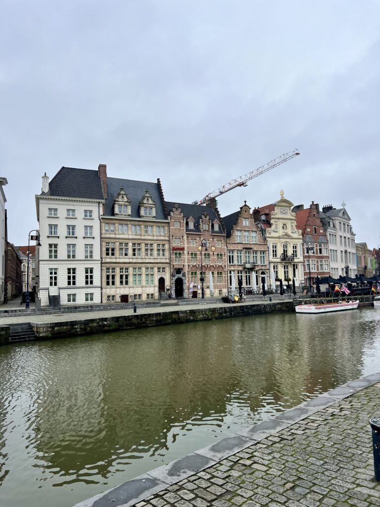 Enchanting view in Gent, Belgium, with ornate medieval architecture and bustling activity, capturing the essence of Belgian heritage and culture; best places to visit in Belgium