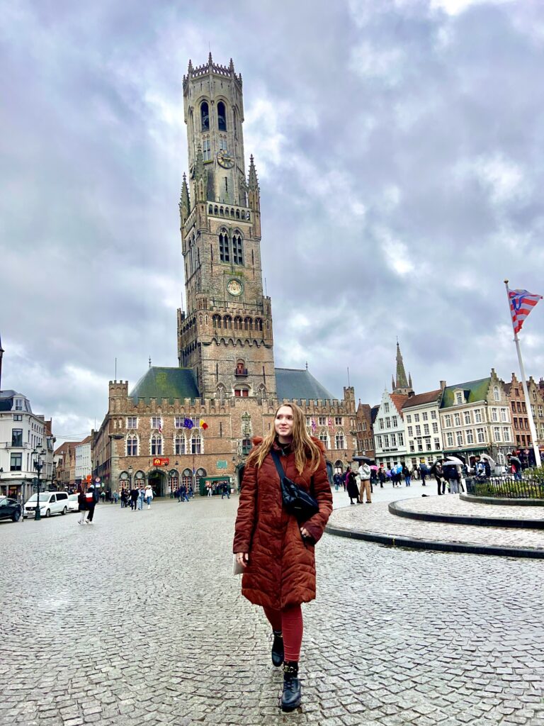 Enchanting view in Brugge, Belgium, with ornate medieval architecture and bustling activity, capturing the essence of Belgian heritage and culture; travel guide to Bruges