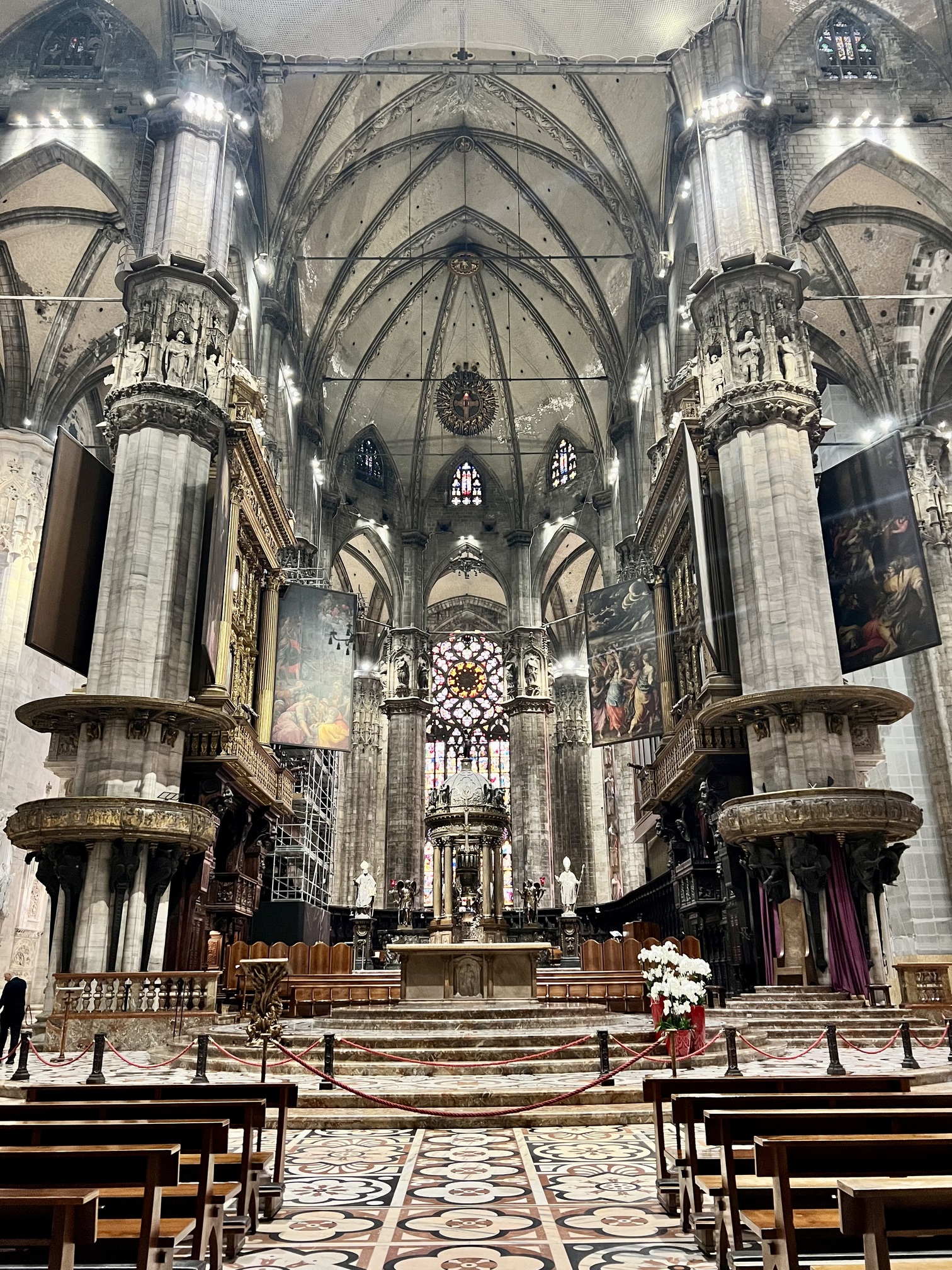 Panoramic view of Milan, Italy showcasing the iconic Milan Cathedral (Duomo di Milano) with its intricate Gothic architecture, bustling Piazza del Duomo, and vibrant cityscape under a clear blue sky. The historic Galleria Vittorio Emanuele II and modern skyscrapers in the background highlight Milan's blend of traditional and contemporary charm, making it a top travel destination for culture, fashion, and architecture enthusiasts. Travel Guide to Italy