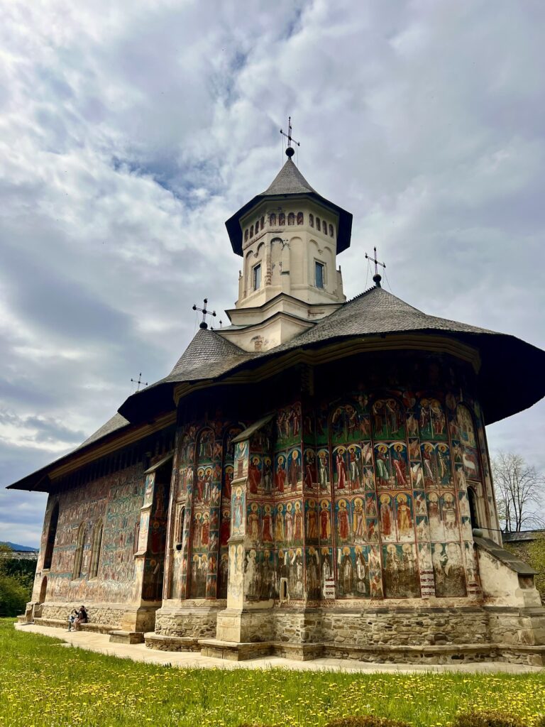 Scenic view of Romania featuring medieval castles, charming villages, and the stunning Carpathian Mountains—perfect for cultural travel enthusiasts and adventure seekers; best places to visit in Romania