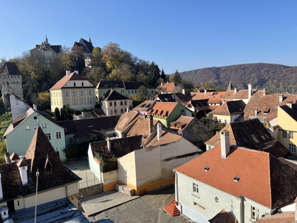 Scenic view of Romania featuring medieval castles, charming villages, and the stunning Carpathian Mountains—perfect for cultural travel enthusiasts and adventure seekers.