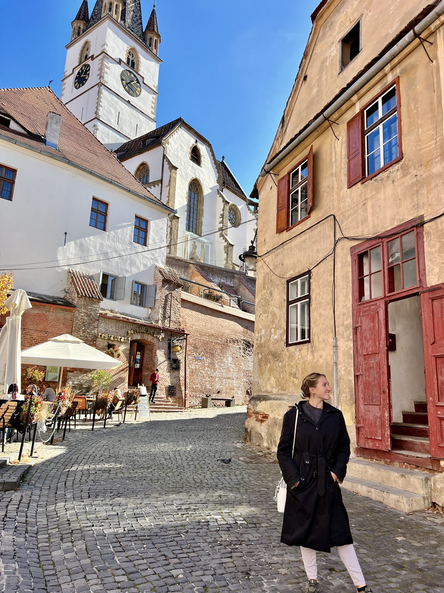 Scenic view of Romania featuring medieval castles, charming villages, and the stunning Carpathian Mountains—perfect for cultural travel enthusiasts and adventure seekers; travel guide to Romania