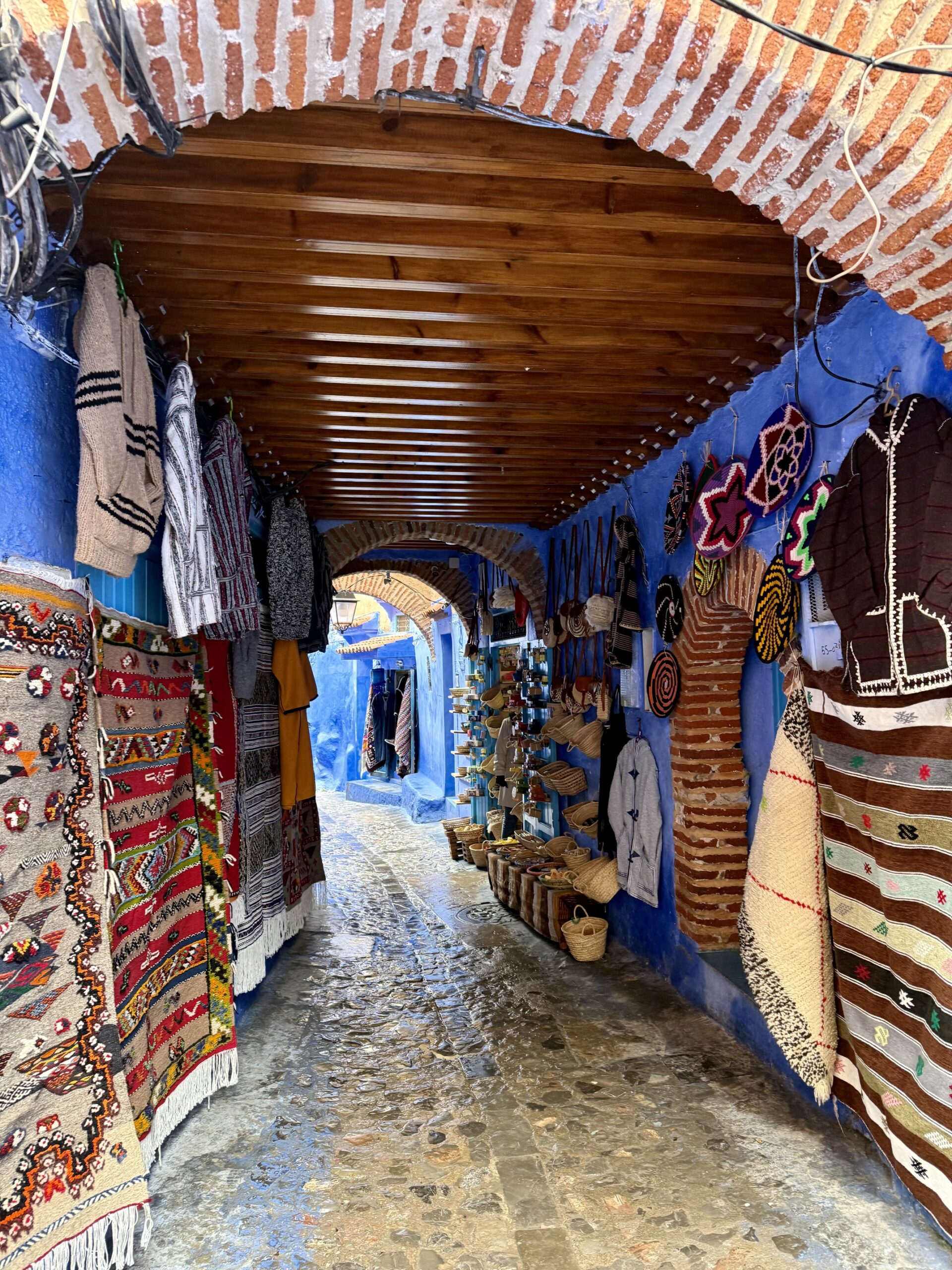 IMG_2623 Colorful streets of Chefchaouen Morocco, known as the Blue City, featuring iconic blue-washed buildings, traditional Moroccan architecture, and scenic Rif Mountain views — top travel destination in Northern Morocco for photography, culture, and authentic experiences; travel guide to Chefchaouen