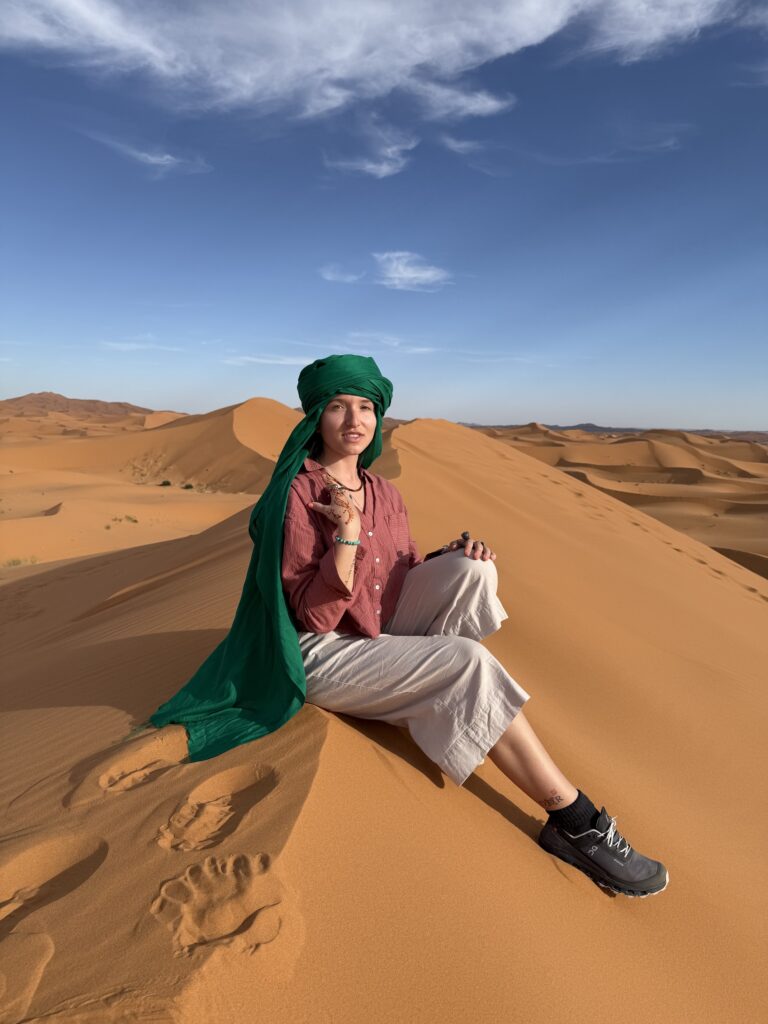 Golden sand dunes of the Sahara Desert in Morocco at sunset with camel caravan — iconic desert landscape for Morocco tours, camel trekking, and glamping in Erg Chebbi near Merzouga, a must-visit adventure travel destination in North Africa; travel guide to the Sahara Desert