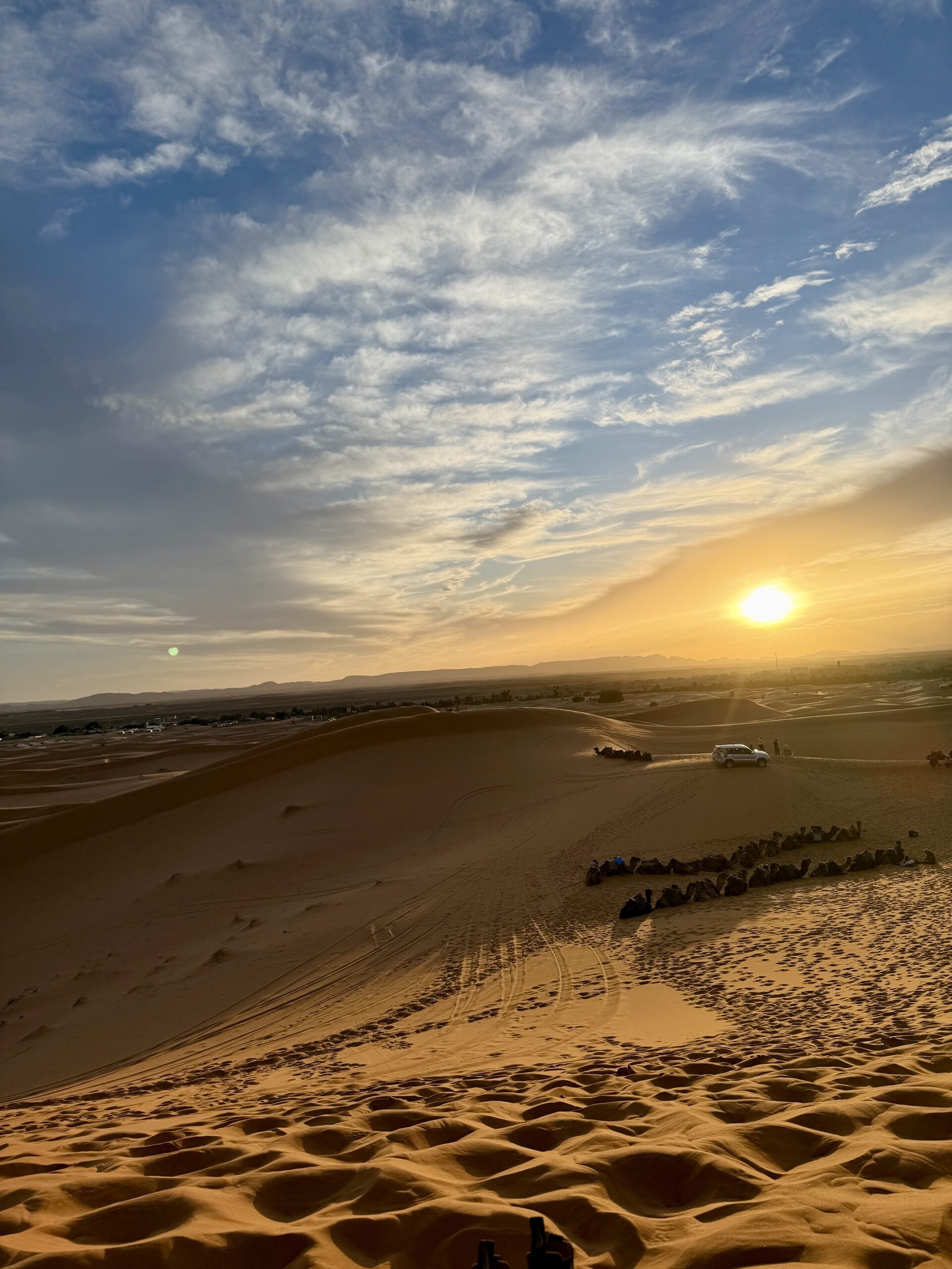 IMG_3337 Golden sand dunes of the Sahara Desert in Morocco at sunset with camel caravan — iconic desert landscape for Morocco tours, camel trekking, and glamping in Erg Chebbi near Merzouga, a must-visit adventure travel destination in North Africa; travel guide to Morocco
