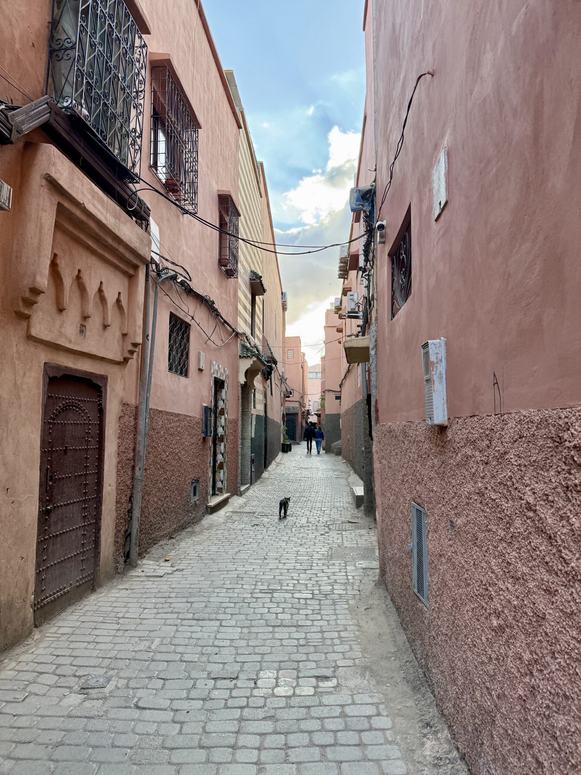 IMG_3484 Vibrant street scene in Marrakech, Morocco featuring colorful souks, traditional riads, and the historic Koutoubia Mosque — top travel destination for Moroccan culture, architecture, and exotic shopping in North Africa; travel guide to Marrakech