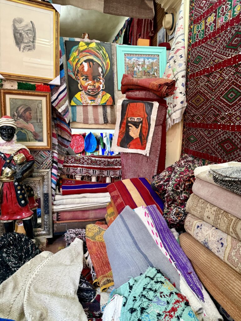 Vibrant street scene in Marrakech, Morocco featuring colorful souks, traditional riads, and the historic Koutoubia Mosque — top travel destination for Moroccan culture, architecture, and exotic shopping in North Africa; galerie Marzouk Marrakech