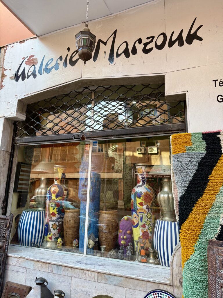 Vibrant street scene in Marrakech, Morocco featuring colorful souks, traditional riads, and the historic Koutoubia Mosque — top travel destination for Moroccan culture, architecture, and exotic shopping in North Africa.