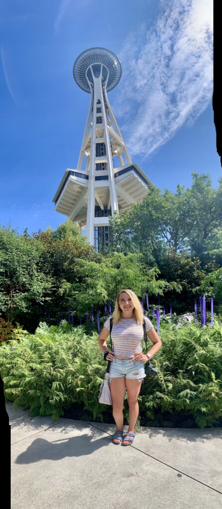 Scenic view of Seattle, Washington skyline with the Space Needle, Mount Rainier in the background, and Elliott Bay waterfront — iconic Pacific Northwest travel destination, top attractions, and things to do in Seattle; travel guide to Seattle