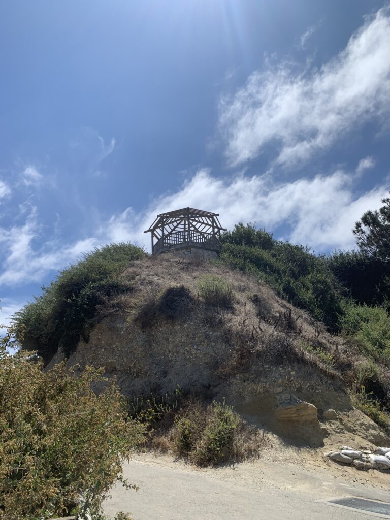 Scenic coastal view of California with Pacific Ocean waves crashing against cliffs, showcasing natural beauty along Highway 1 near Big Sur — top travel destination in the United States; best places to visit in California