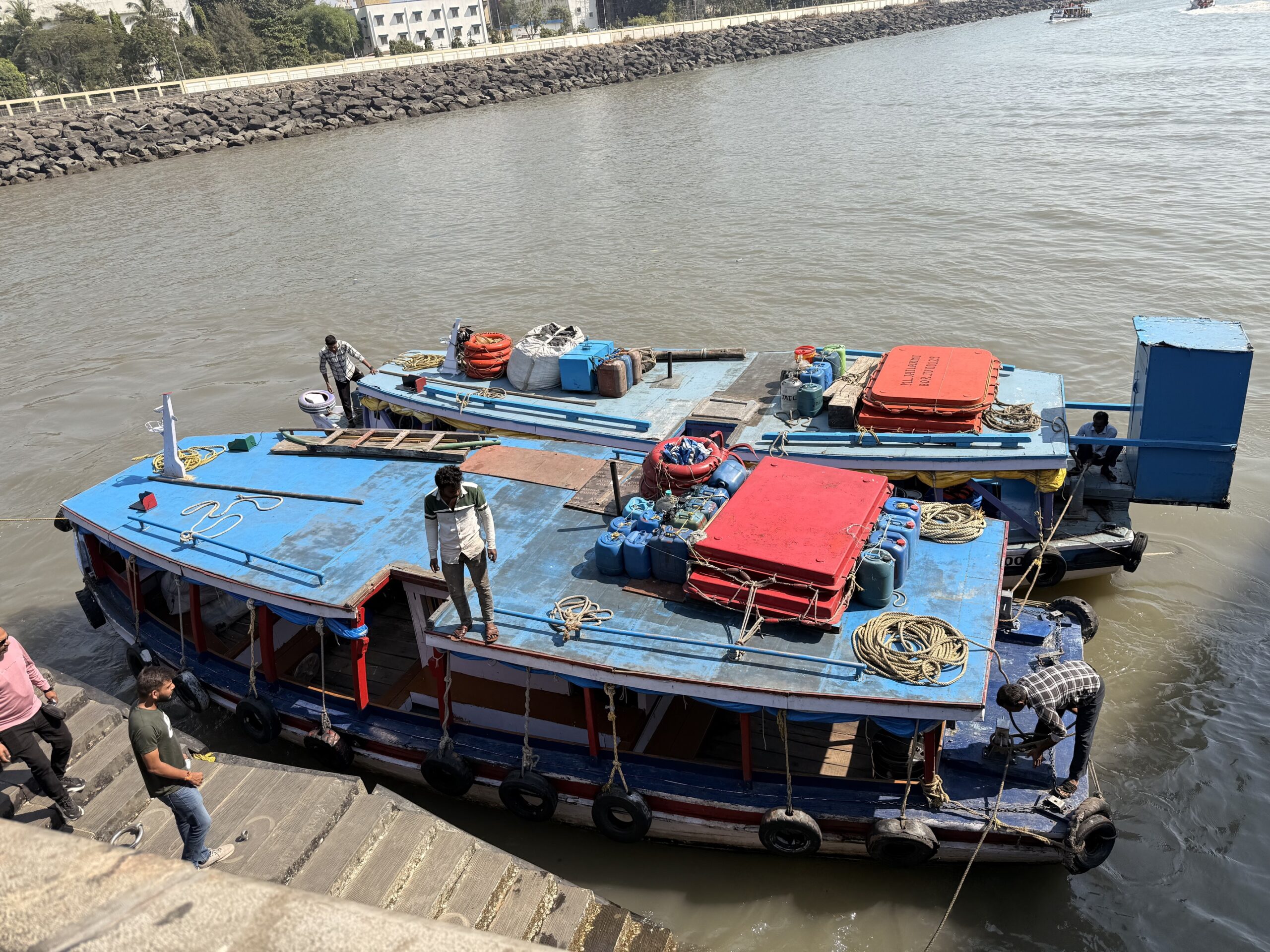 Busy street scene in Mumbai with tuk-tuks taxis and pedestrians
