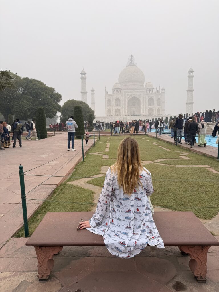 Taj Mahal in Agra reflected in the long pool at sunrise India travel guide; Best Places to Visit in India
