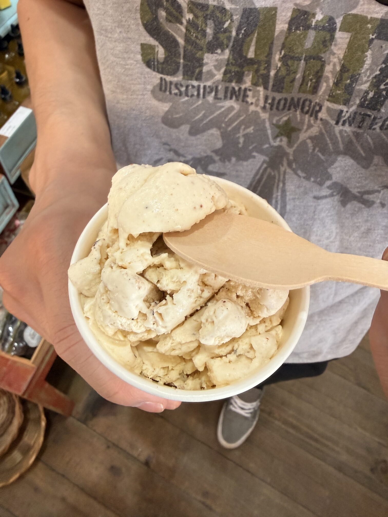 Fresh nutmeg fruit split open to reveal a bright red mace surrounding the seed, Grenada's famous spice island produce