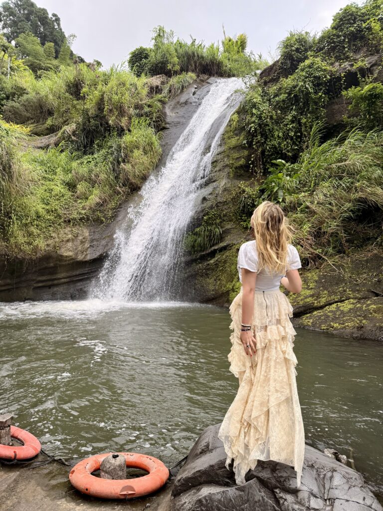 Annandale Falls cascading into a natural pool surrounded by tropical rainforest in Grenada's interior highlands; safety tips for traveling in Grenada