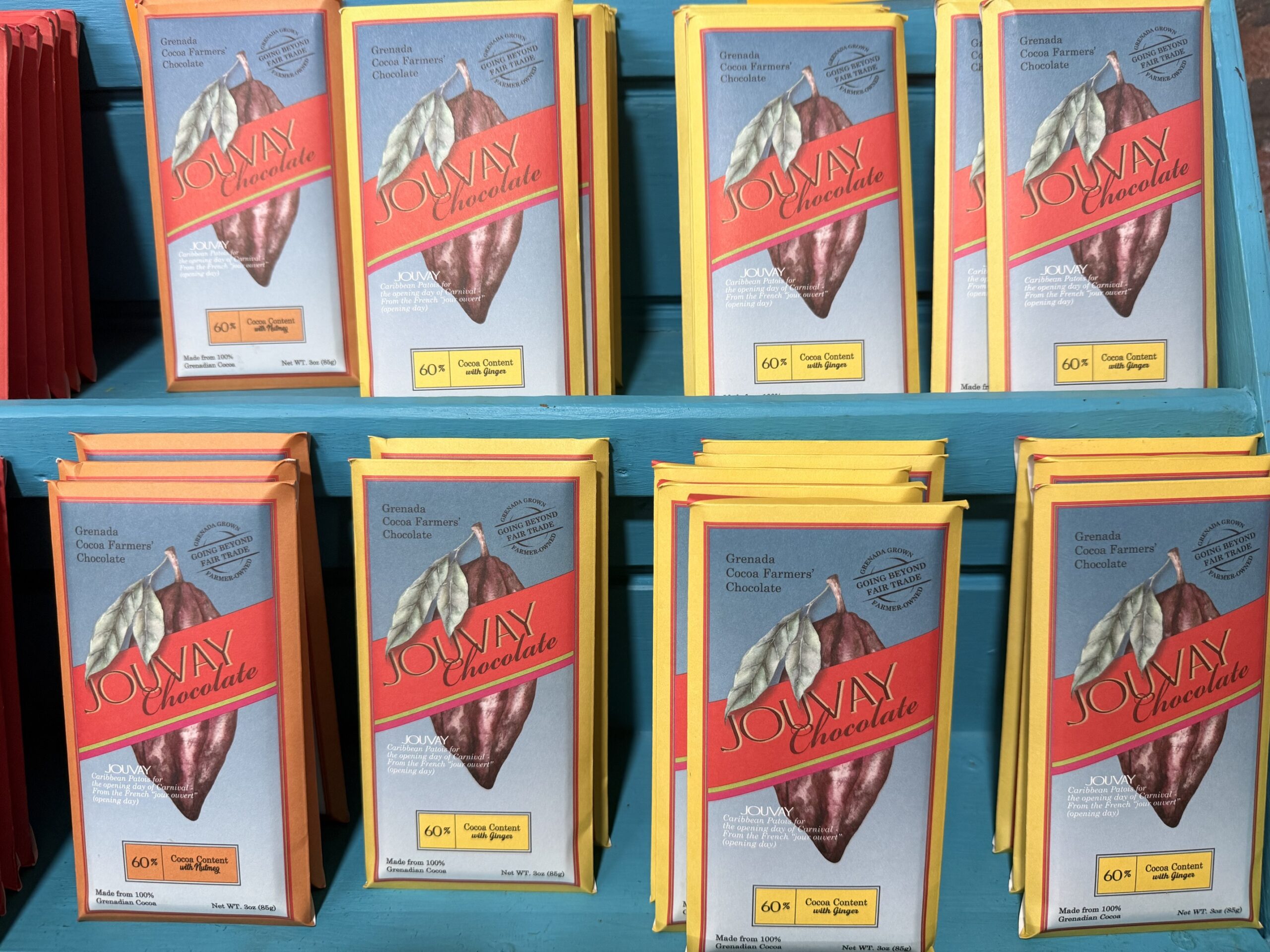 Fresh nutmeg fruit split open to reveal a bright red mace surrounding the seed, Grenada's famous spice island produce; What Souvenirs to Buy in Grenada