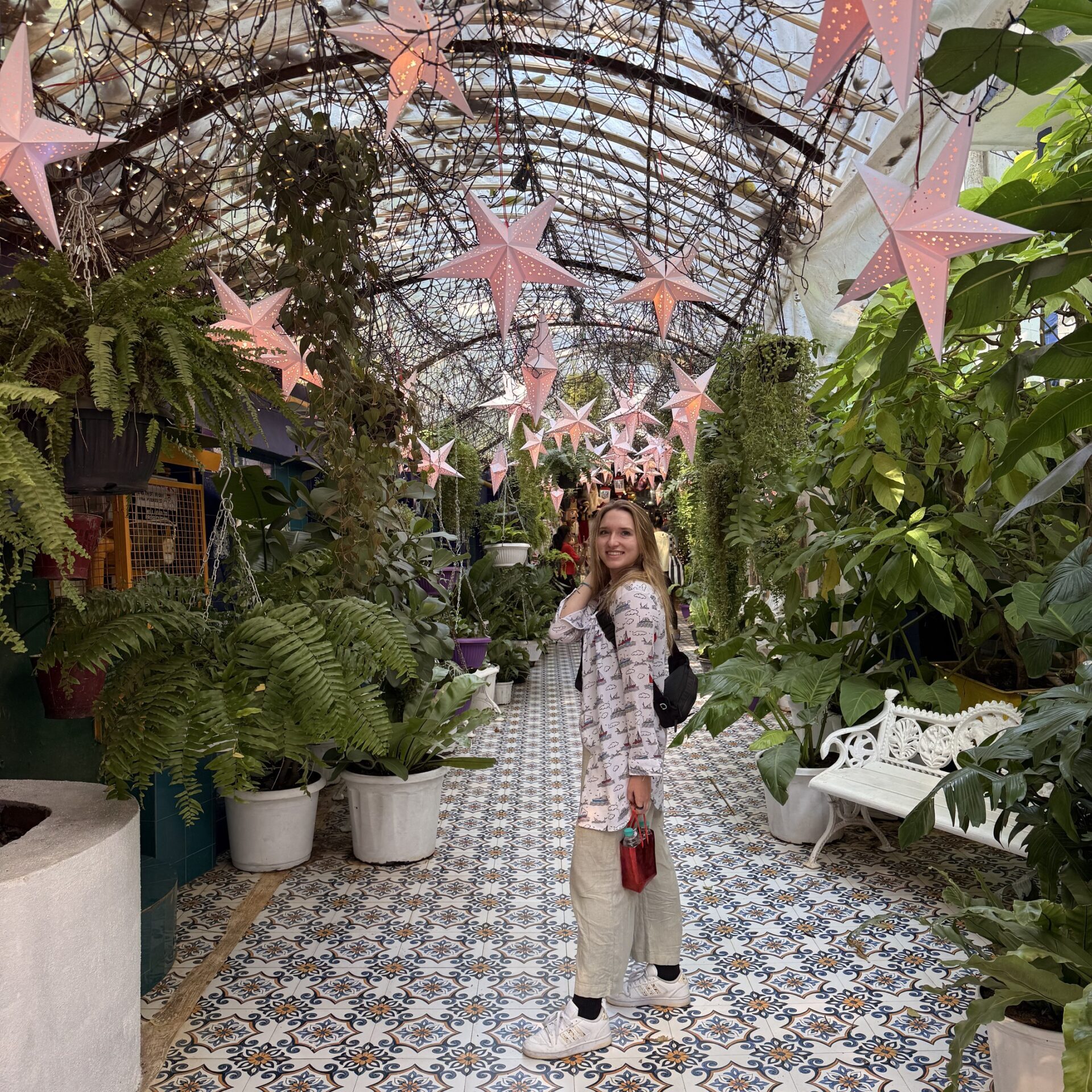 Busy street scene in Mumbai with tuk-tuks taxis and pedestrians