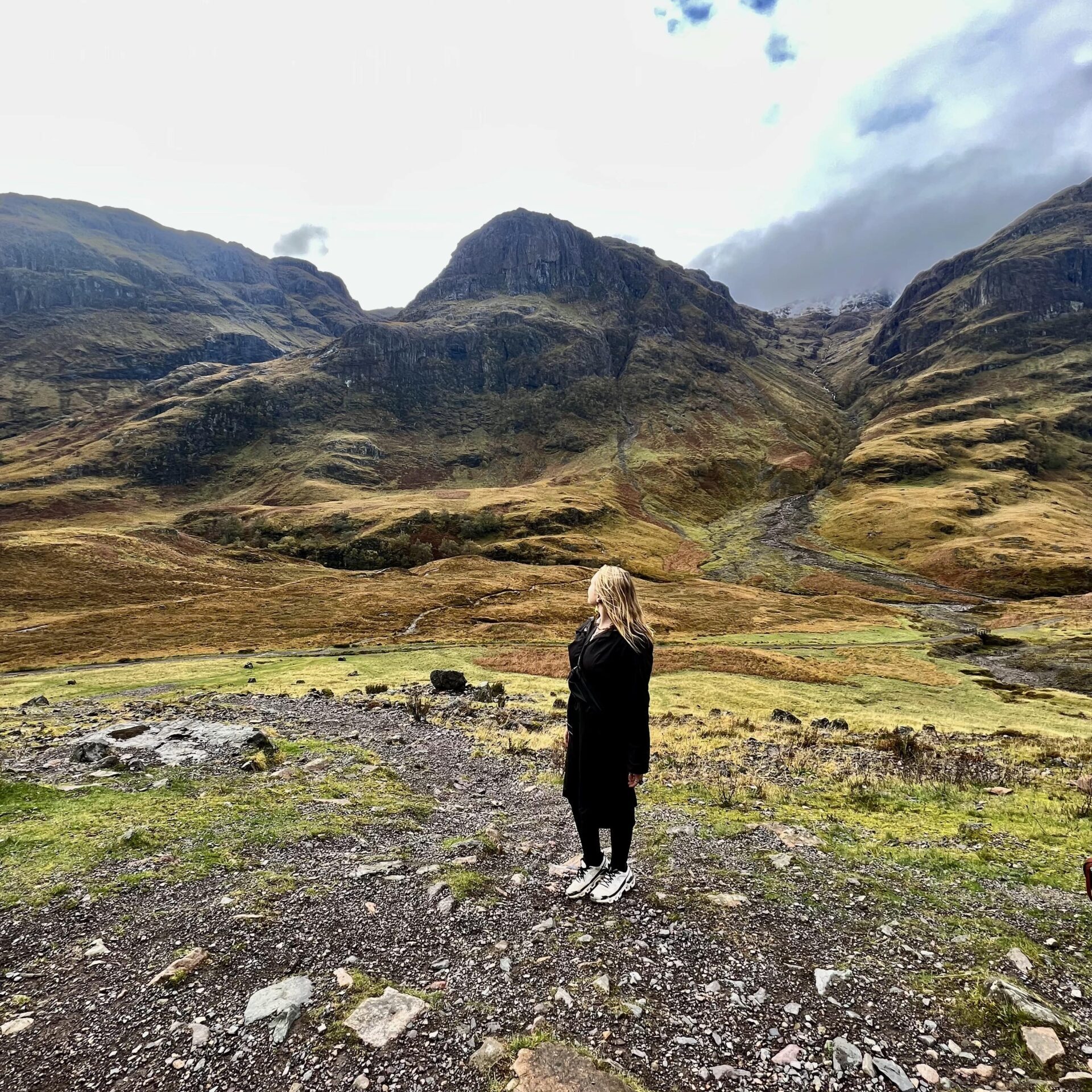 Captivating Scotland: Lush Green Hills under Overcast Skies - Travel Inspirations; travel guide to Scotland