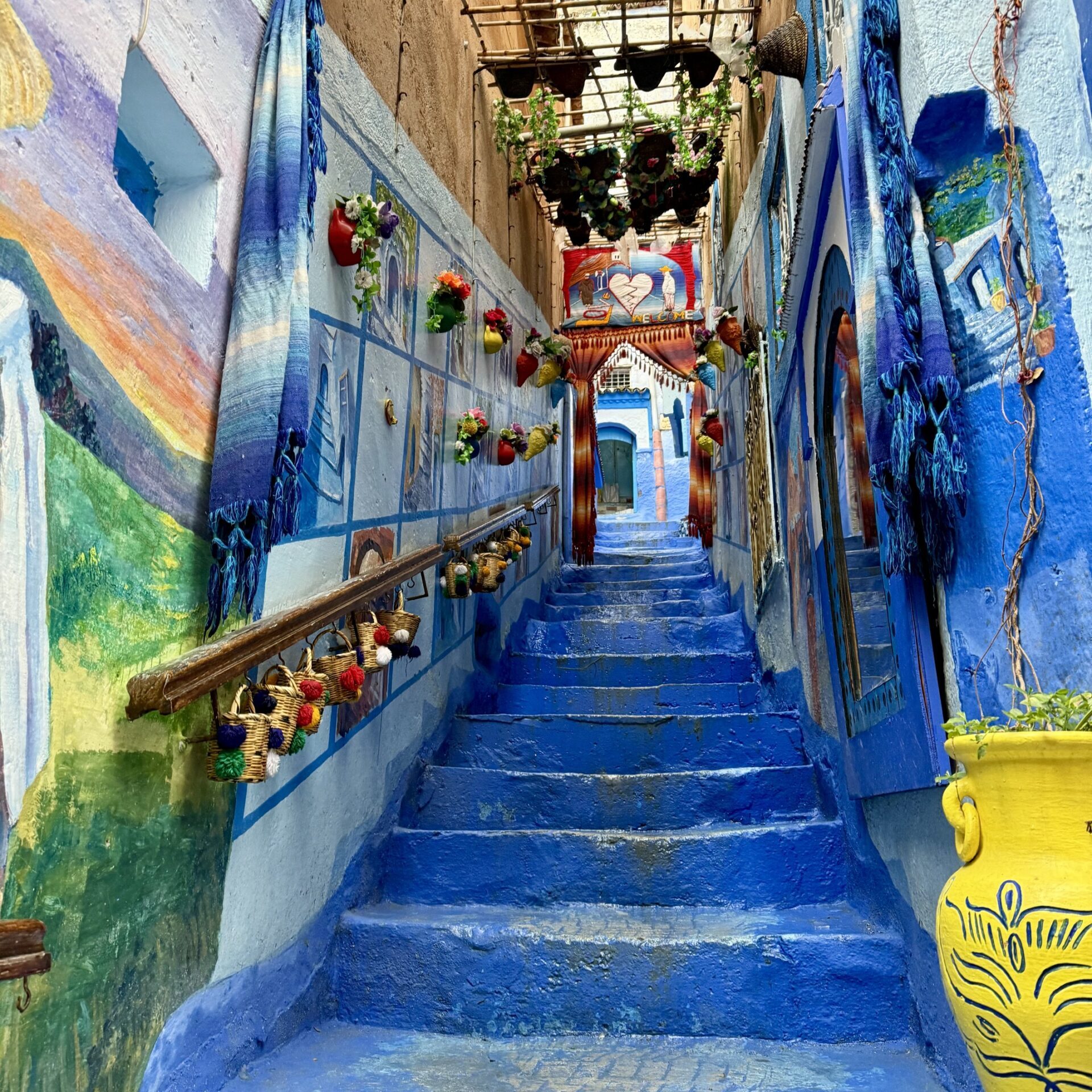 IMG_2706 Colorful streets of Chefchaouen Morocco, known as the Blue City, featuring iconic blue-washed buildings, traditional Moroccan architecture, and scenic Rif Mountain views — top travel destination in Northern Morocco for photography, culture, and authentic experiences.