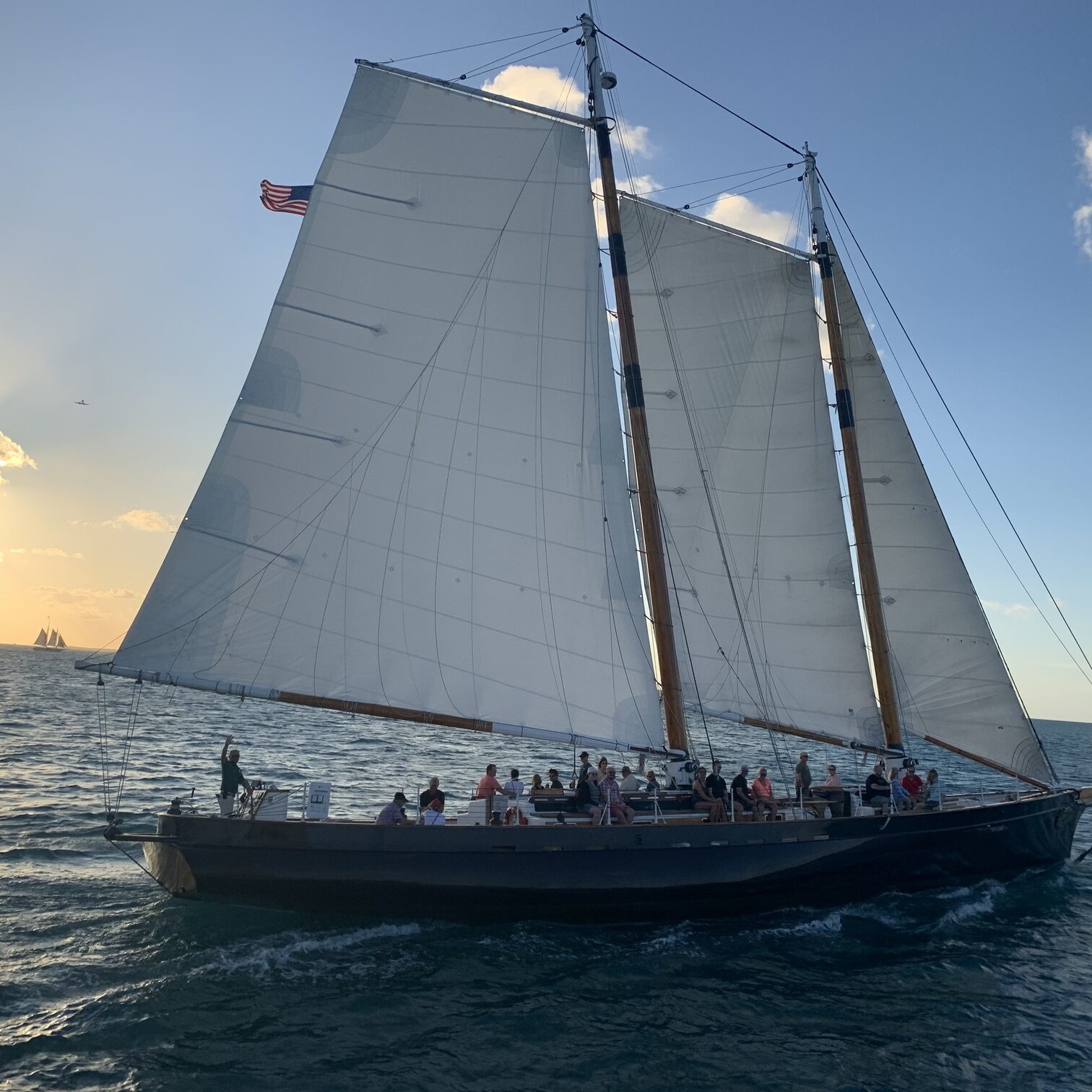 IMG_9445 Scenic view of Key West Florida at sunset with palm trees, turquoise ocean, and historic waterfront—popular tropical travel destination known for beach vacations, island vibes, and coastal getaways.